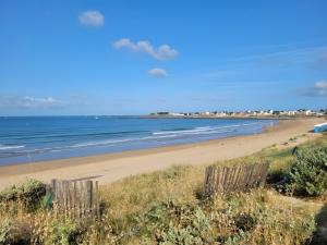 a view of a beach with the ocean at Chambre D'hôtes À 2 Pas Des Plages in Notre-Dame-de-Riez +7 photos