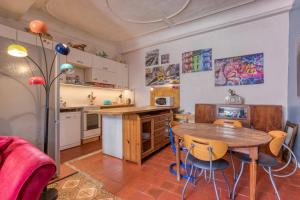 a kitchen with a table and chairs in a room at Agde Heritage, No. 16 in Agde +31 photos