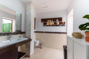 a bathroom with a sink and a toilet at Eclipse in Puerto del Rosario +19 photos