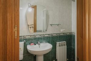 a bathroom with a sink and a mirror at El Humilladero in Sasamón +28 photos