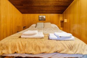 a bedroom with a bed with towels on it at Valle De Juarros in San Adrián de Juarros +25 photos