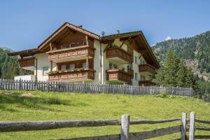 a house on a hill with a fence at Ferienhaus Maria Arnika in Moso +12 photos