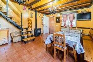 a dining room with a table and a fireplace at Valle De Juarros in San Adrián de Juarros