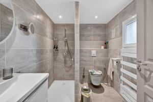 a bathroom with a shower and a toilet at Cabanon des Amandiers avec terrasse in Sanary-sur-Mer +12 photos