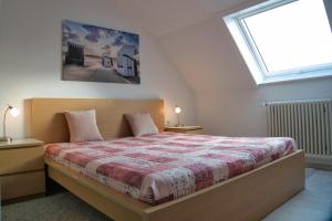 a bedroom with a bed with a large window at Kunibert, 120 qm in Stockach
