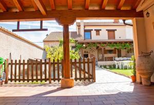 a wooden fence in front of a house at Casa Mariano in Turégano