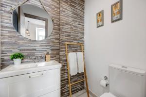 a bathroom with a sink and a mirror at Villa Xique 9 in Monchique +17 photos