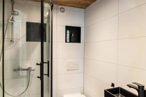 a bathroom with a shower and a sink at Haus Auner Top 5b in Westendorf +13 photos