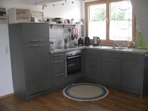 a kitchen with a sink and a stove top oven at Straussi´s Loft in Tuttlingen
