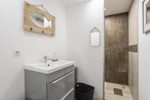 a bathroom with a sink and a shower at L' Eclose Ty Du in Le Guilvinec +19 photos