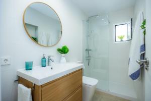 a bathroom with a sink and a mirror at Casa Antonia in Cala Millor +25 photos