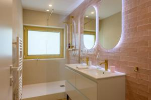 a bathroom with a sink and a shower and a mirror at Refuge Mil100 Chalet-spa Luxe 5 in Metzeral +31 photos