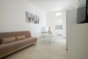 a living room with a couch and a table at Villa Terry in Ostuni