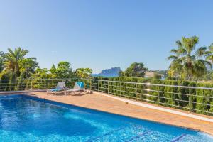 a swimming pool in a villa with a view at Casa Once Moraira in Teulada