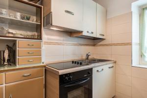 a kitchen with a sink and a stove at Casa Sicina Alberto in Valfloriana