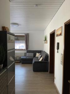 a living room with a couch and a living room at Ferienwohnung M Keller in Hollfeld