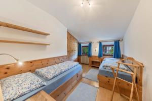 a bedroom with two bunk beds and a ladder at Florerhof Ferienwohnung Flieder in Vols am Schlern