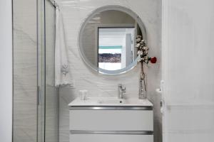 a bathroom with a sink and a mirror at El Pasero in El Golfo