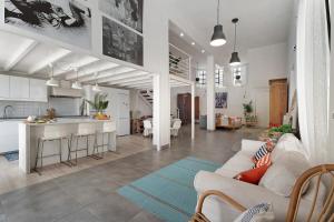 a living room with a couch and a kitchen at Vista Alegre 22 B in El Paso