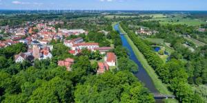 an aerial view of a town next to a river at Waldhaus Jakober in Maasdorf +2 photos