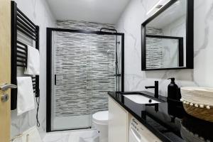 a bathroom with a shower and a toilet and a sink at Casa da Lage in Castelo do Neiva +34 photos