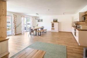 a kitchen and dining room with a table and chairs at Ferienwohnung Häfele 1 in Bad Wurzach