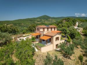 an aerial view of a house in the hills at Oltremare in Riparbella