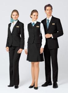 a man and two women dressed in suits and ties at Hotel Royal One in Multan