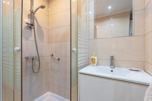 a bathroom with a shower and a sink at Sunny studio with seaview in Fuengirola