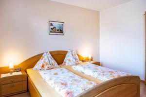 a bedroom with two beds with pillows on them at Valtlhof - Apt 1 in Cornaiano +23 photos