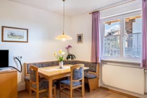 a dining room with a table and chairs at Valtlhof - Apt 1 in Cornaiano