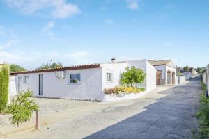 a street in a village with white houses at Loft Rural in El Soto