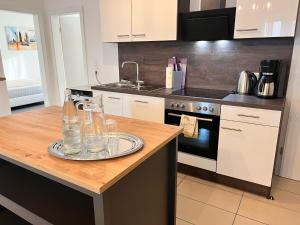 a kitchen with a table with glasses on it at Dreams Lodge in Koetz 