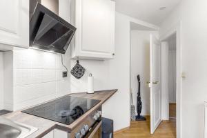 a kitchen with a sink and a stove top oven at Ferienwohnung Am Osttor in Warendorf