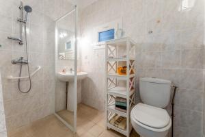 a bathroom with a toilet and a shower and a sink at Gîte Chez Martha in Anduze +17 photos