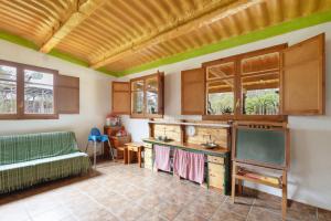 a kitchen with a couch and a table at Cal Panxeta in Balsareny