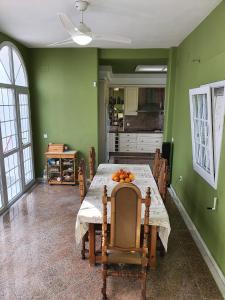 a dining room with a table with fruit on it at Finca Campo Viejo in Isla Cristina