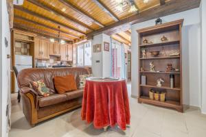 a living room with a couch and a table at Casa Petra in Illora