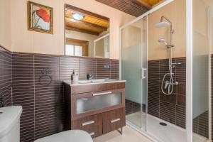 a bathroom with a toilet sink and a shower at Casa Petra in Illora +44 photos