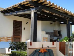 a pergola over a fireplace in a house at Isola Di Favignana in Favignana