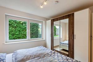 a bedroom with a mirror and a bed in it at Ferienwohnung Kleine Auszeit in Schmallenberg