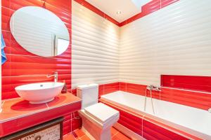 a bathroom with a tub and a sink and a toilet at The Mountain Villa in Aleimmatádes +23 photos