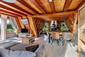 a living room with a couch and a table at Villa Natura in Meschede +16 photos