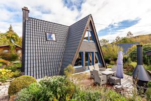 a small house with a pitched roof at Villa Natura in Meschede