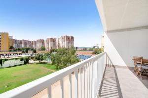 a balcony with a view of a city at Lopimar Bonito in Canet de Berenguer