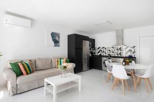 a living room with a couch and a table at Noray 2 in La Santa