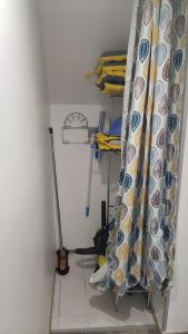 a room with a bed with a curtain on a shelf at Gîte Du Vignal in Mazeyrat-d'Allier
