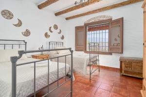 a bedroom with two bunk beds and a window at Casa Miraflores in Arenas +27 photos