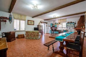 a large living room with a table and a couch at Il Giglio Rosa in Sorso