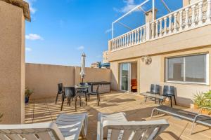 a patio with chairs and a table on a balcony at Apartment in Bolnuevo in Bolnuevo